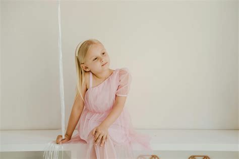 Little Girl Bending Over Free Stock Photo